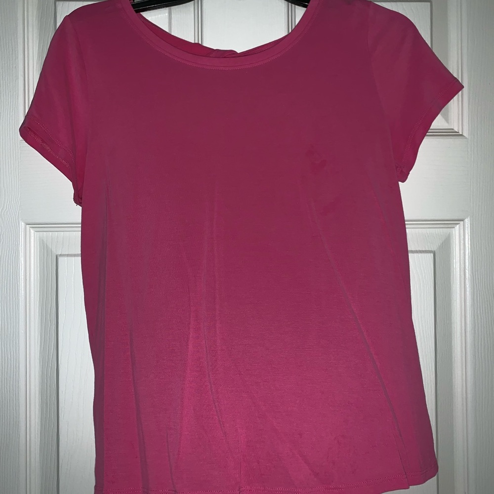 Hot pink shirt with cross in the back